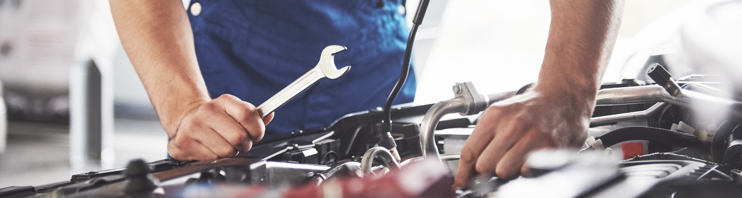 young mechanic working his workshop 1